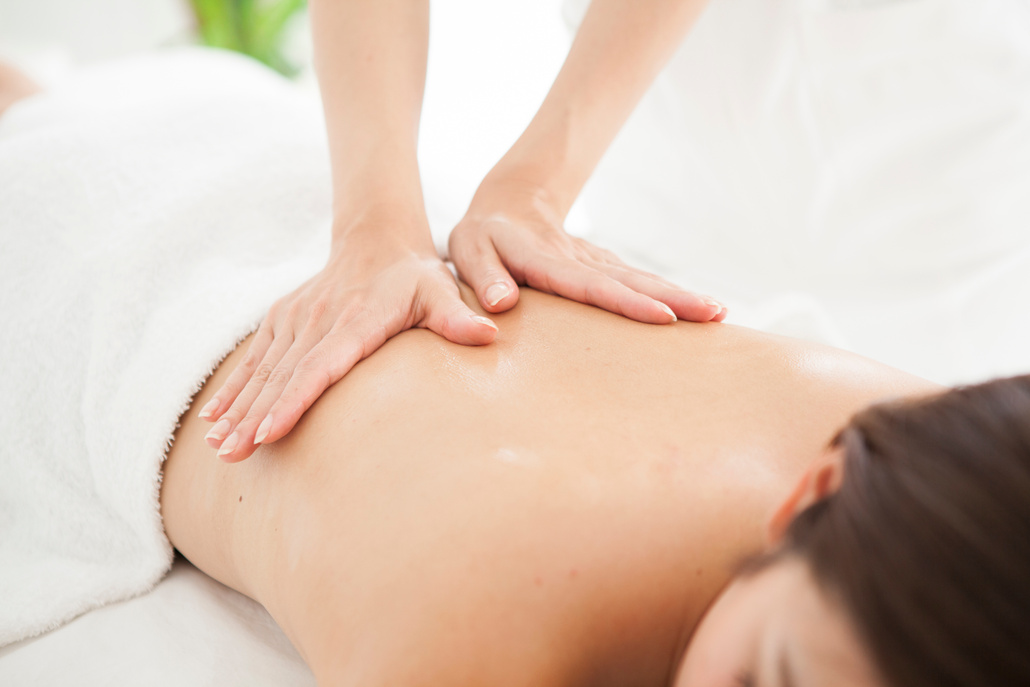 Woman being massaged for health by an esthetic salon